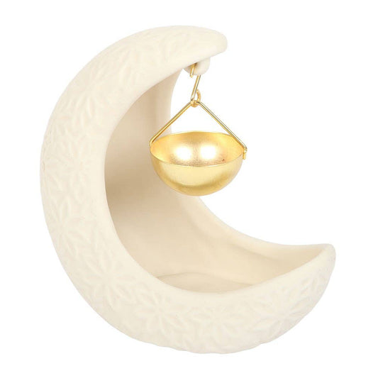 Decorative item with a white crescent moon shape and gold hanging element on a white background