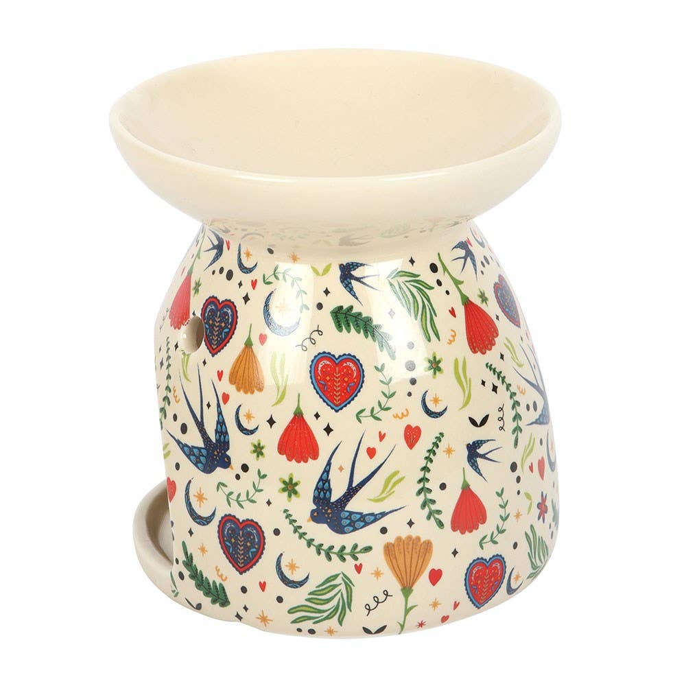 Decorative ceramic oil burner with colorful patterns on a white background