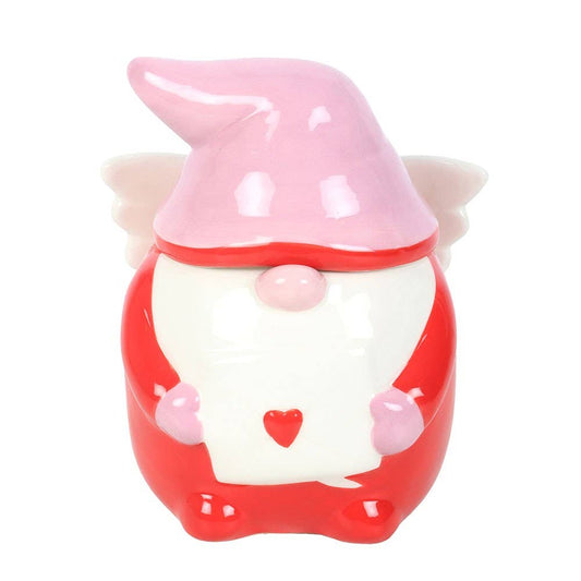 Ceramic gnome figurine with a pink hat and red body on a white background