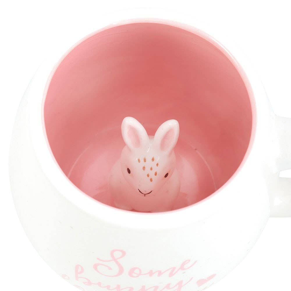 Pink bunny-shaped object with a white background