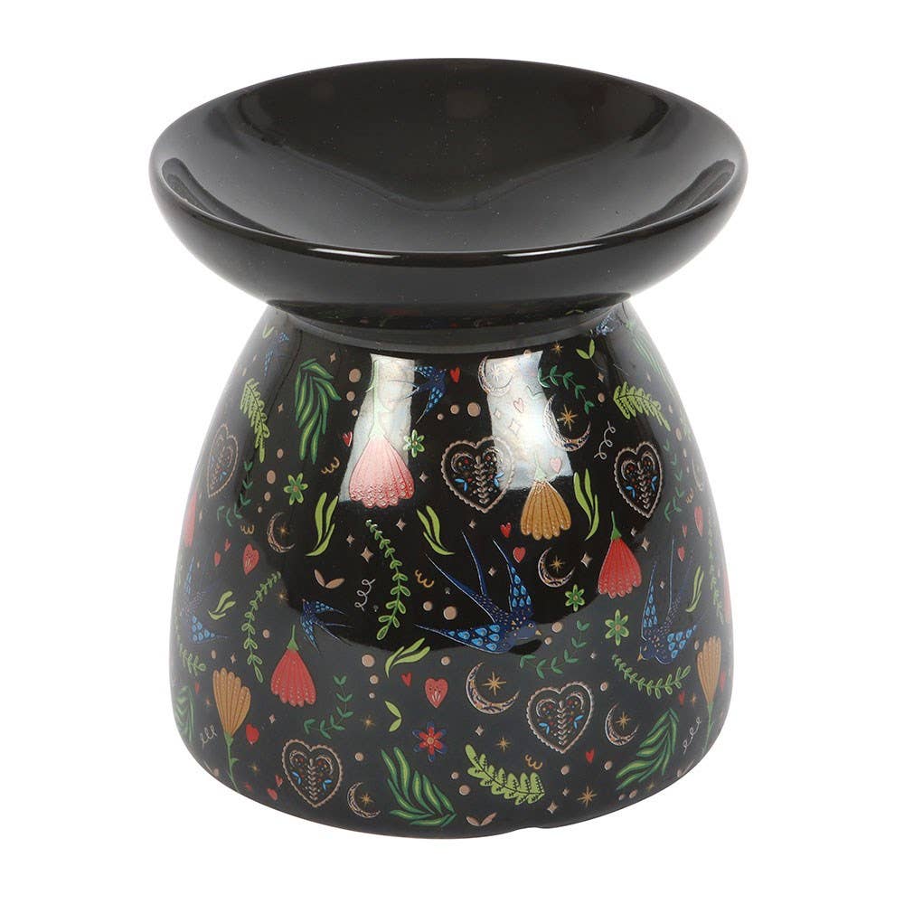Decorative oil burner with colorful patterns on a white background