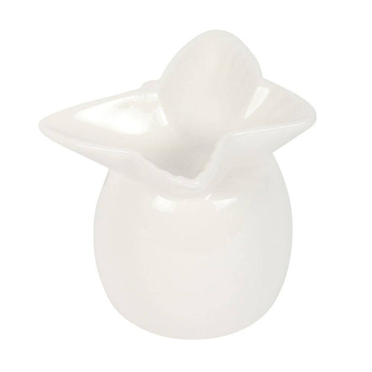 White ceramic duck-shaped object on a white background